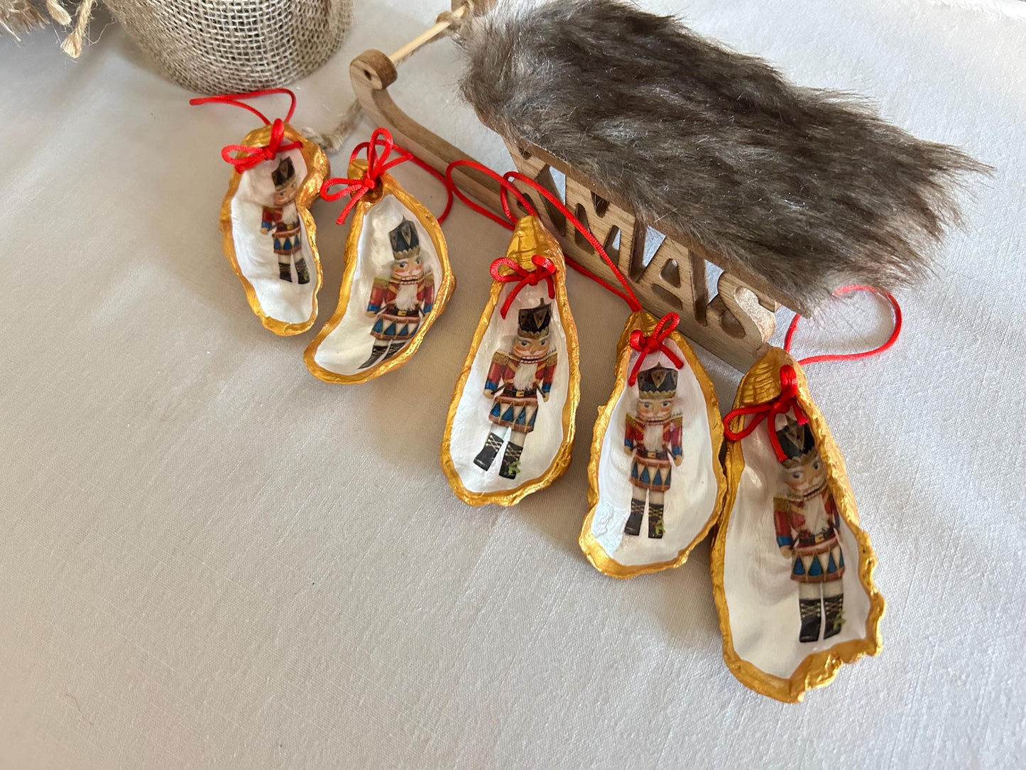 Nutcracker Oyster Shell Hanging Bauble. Festive Gold Christmas Soldier Tree Decoration.
