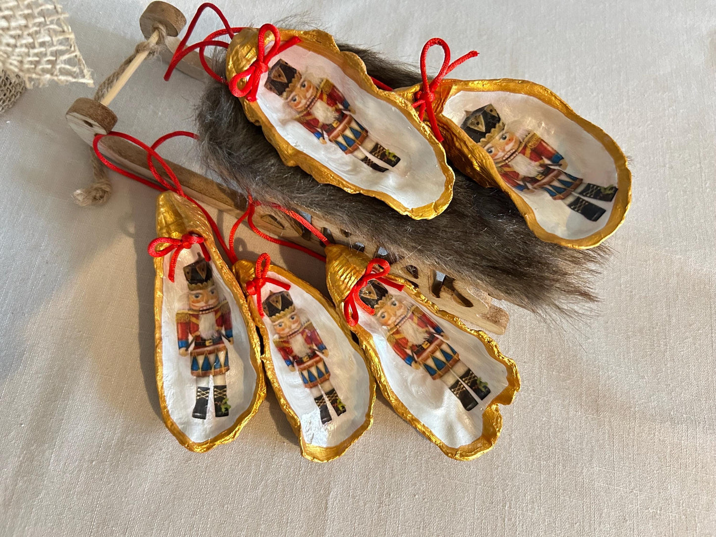 Nutcracker Oyster Shell Hanging Bauble. Festive Gold Christmas Soldier Tree Decoration.