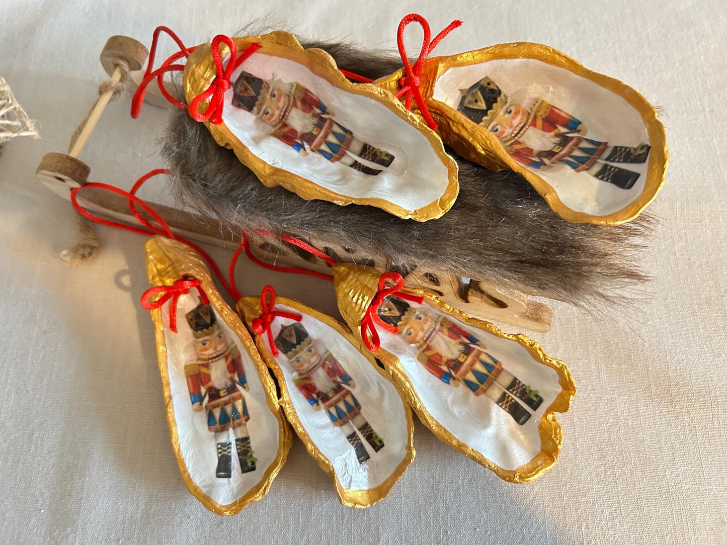 Nutcracker Oyster Shell Hanging Bauble. Festive Gold Christmas Soldier Tree Decoration.