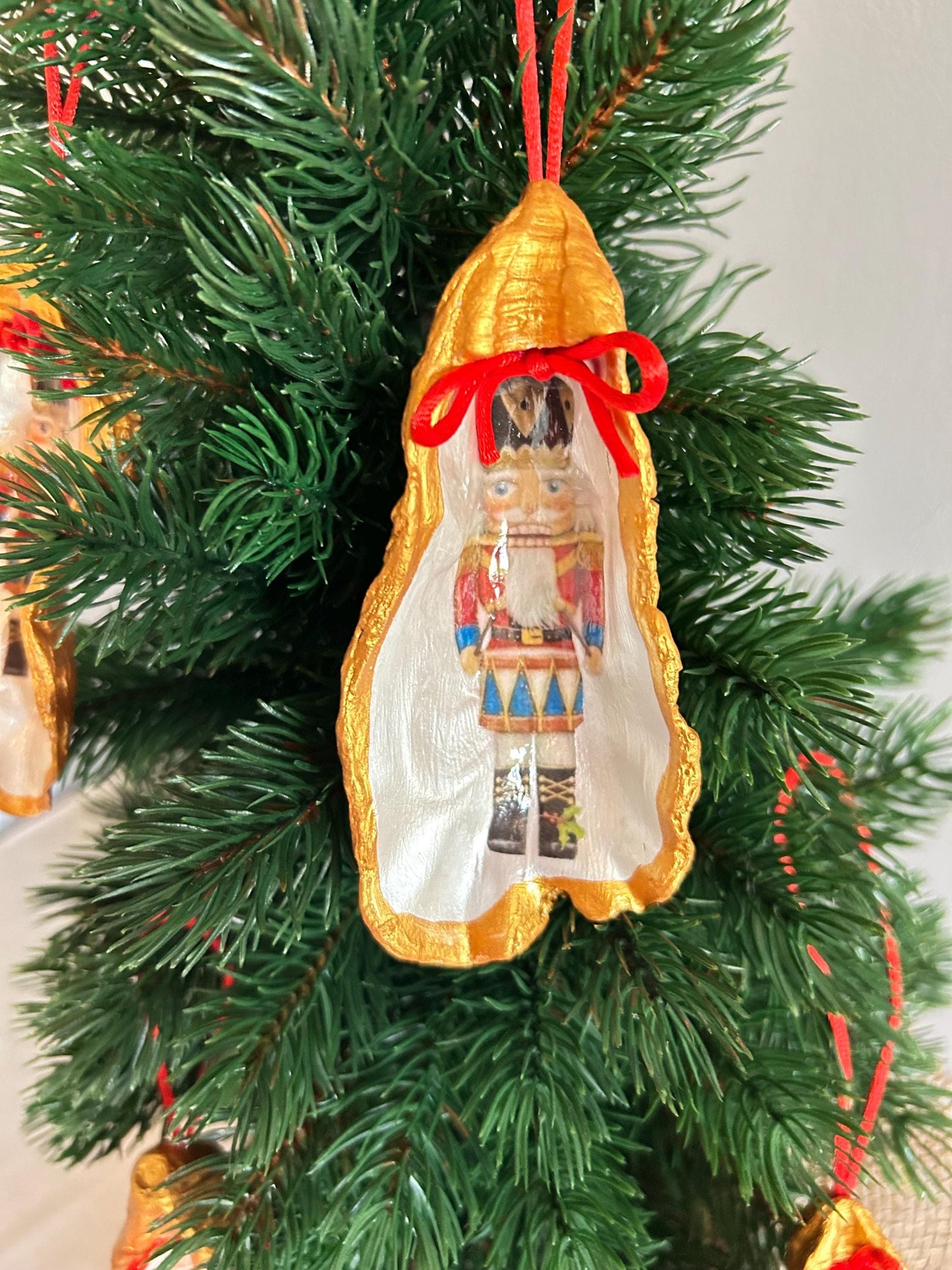 Nutcracker Oyster Shell Hanging Bauble. Festive Gold Christmas Soldier Tree Decoration.
