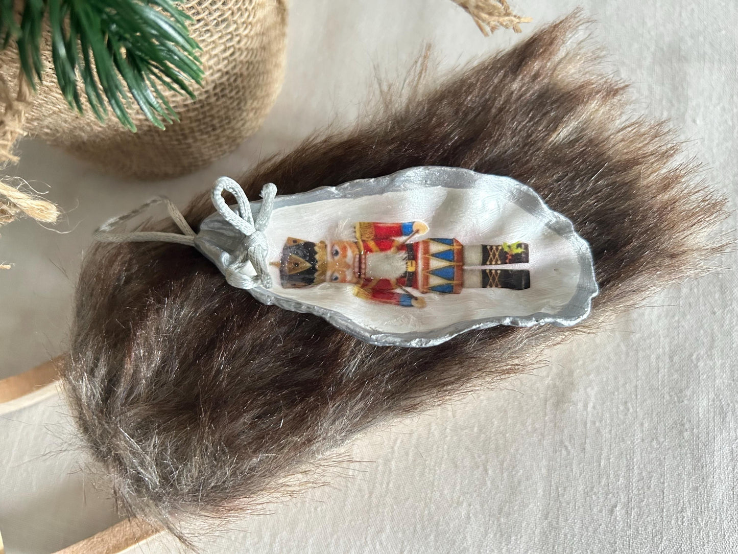 Silver Nutcracker Ornament. Coastal Holiday Home Decoration. Oyster Shell Bauble.