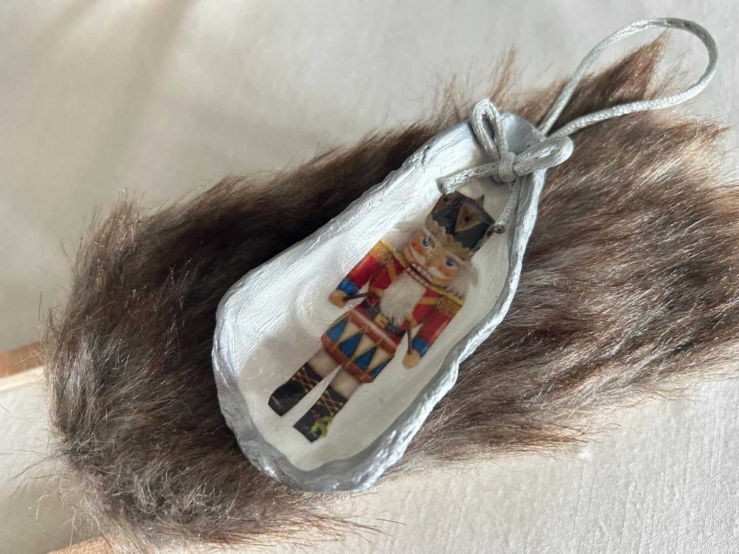 Silver Nutcracker Ornament. Coastal Holiday Home Decoration. Oyster Shell Bauble.