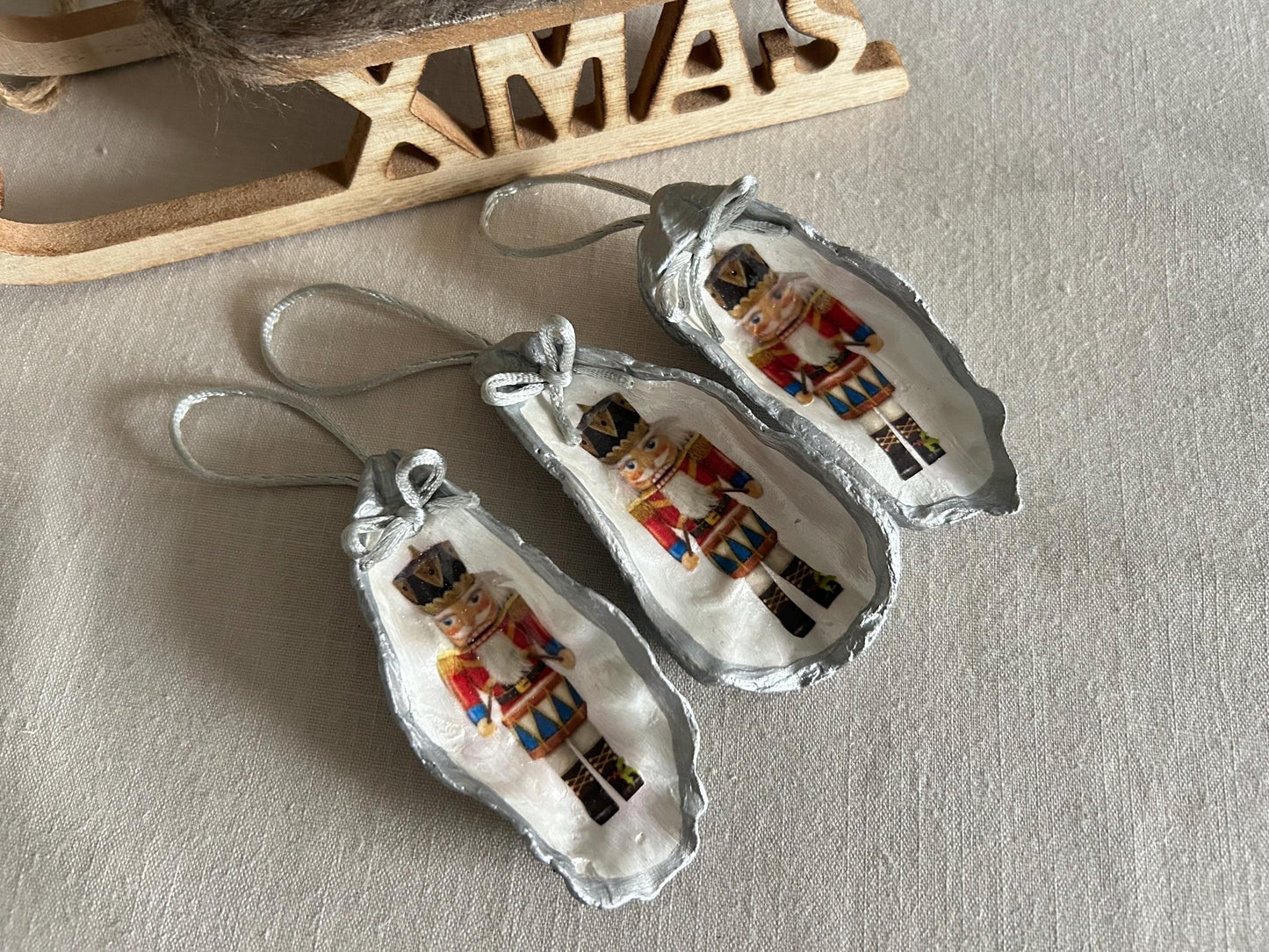 Silver Nutcracker Ornament. Coastal Holiday Home Decoration. Oyster Shell Bauble.