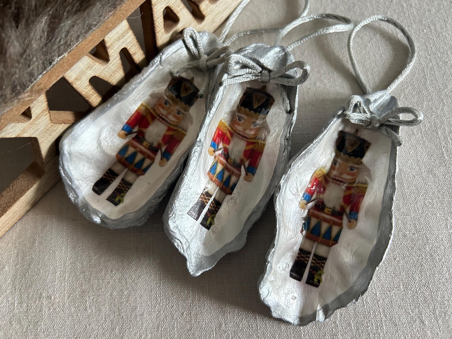 Silver Nutcracker Ornament. Coastal Holiday Home Decoration. Oyster Shell Bauble.