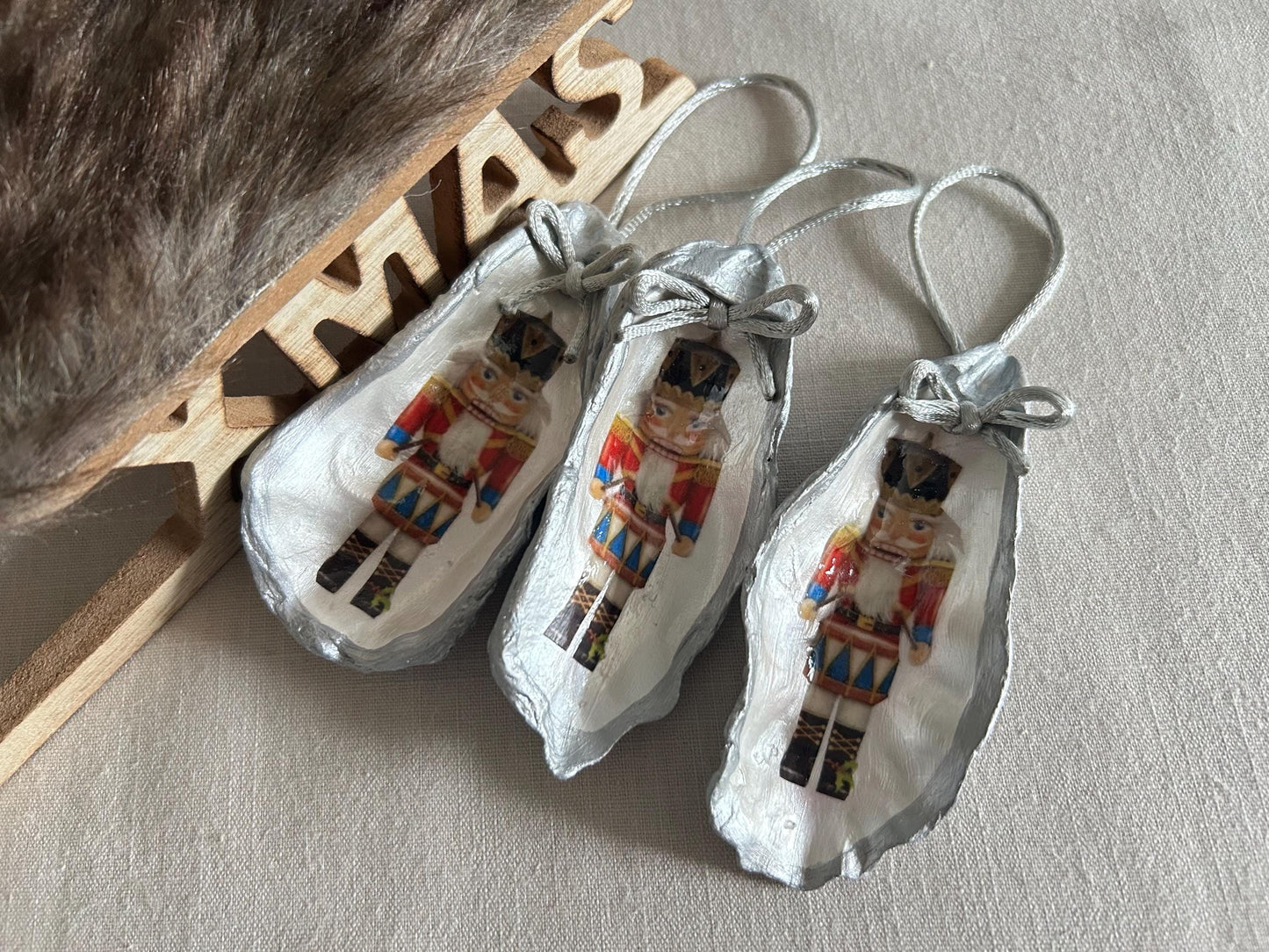 Silver Nutcracker Ornament. Coastal Holiday Home Decoration. Oyster Shell Bauble.