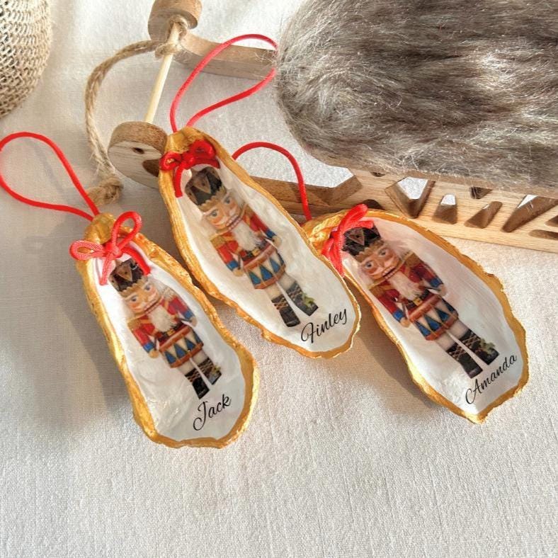 Personalised Nutcracker Oyster Shell Hanging Bauble. Festive Gold Christmas Soldier Tree Decoration.
