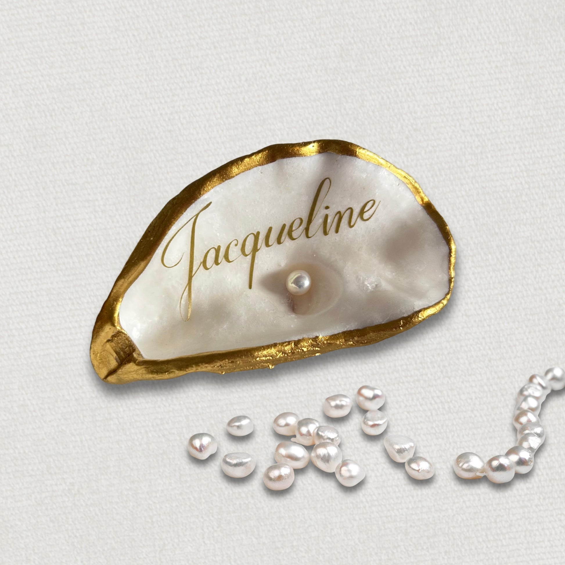 These natural oyster shells place names will add a touch of sophisticated luxury to your beach inspired wedding.  Finished in a luxurious antique gold on the rims and the inside and underside have been left natural ready to personalise with your guests names.
