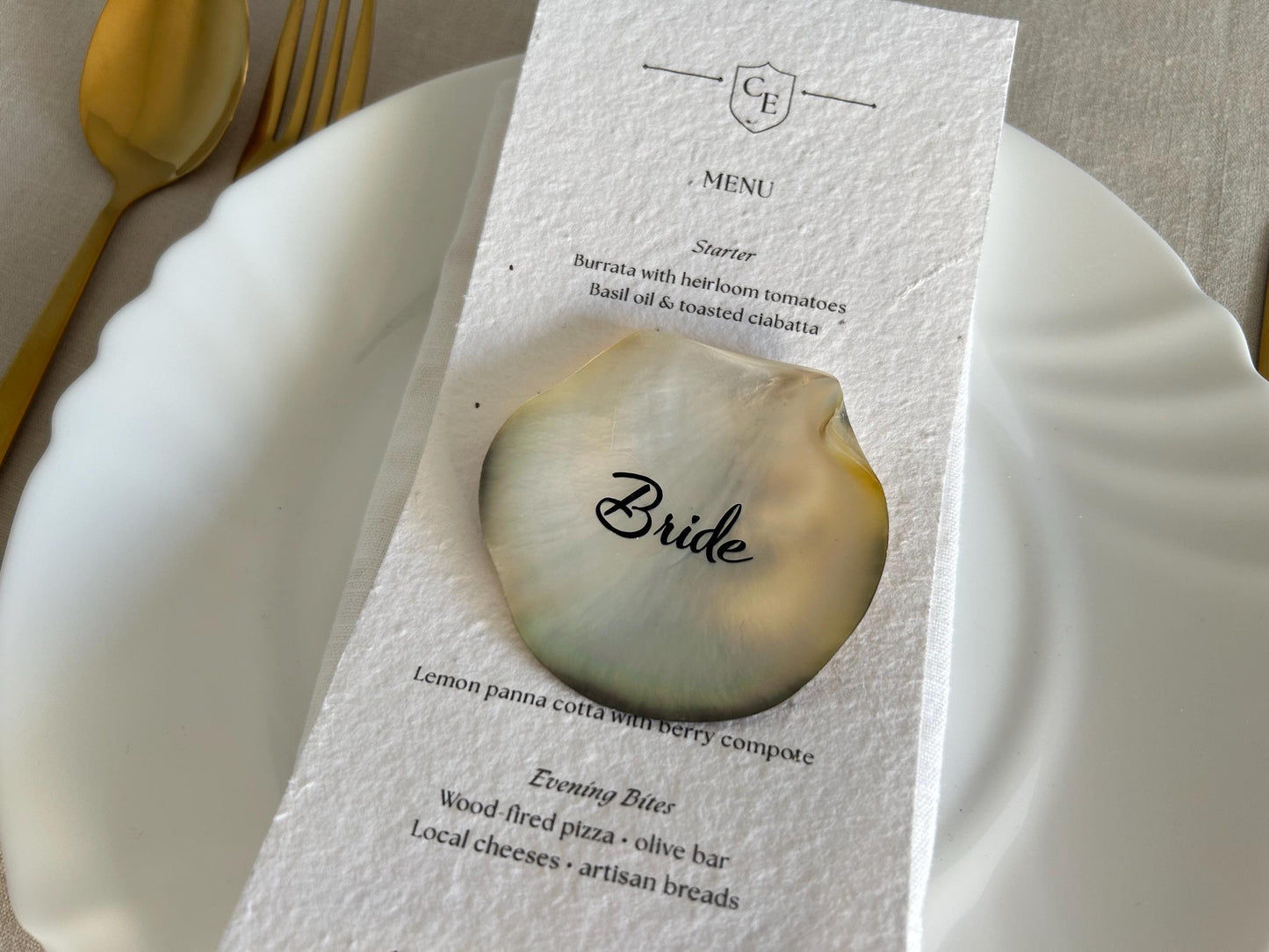 Elevate your table styling with these Black Lip Oyster Shell place cards, featuring a naturally iridescent black mother of pearl finish. Each shell is carefully personalised to create a striking yet timeless addition to your wedding or special event.