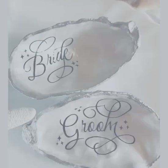 Oyster Shell Wedding Place Card and Favour. Personalised place names for your beach wedding decor. Silver coastal shell place settings.