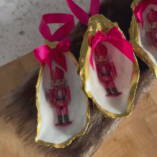 Pink Retro Nutcracker Oyster Shell Ornament. Gold and Cerise Handcrafted Christmas Bauble.