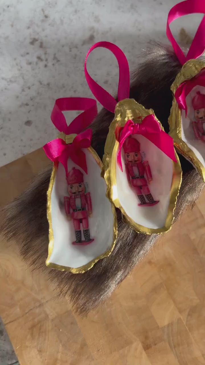 Pink Retro Nutcracker Oyster Shell Ornament. Gold and Cerise Handcrafted Christmas Bauble.